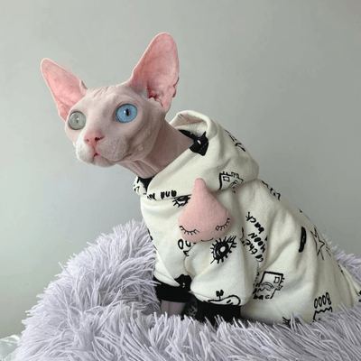 Peaceful sphynx cat resting with self-love and Christmas joy